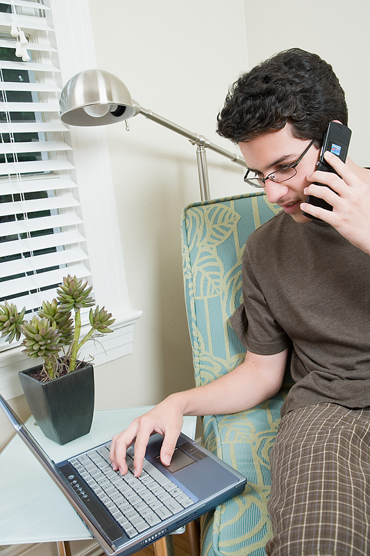 Guy on a Computer & a Phone